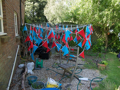 Bunting, sprayed with fire-retardent, drying on the clothes line